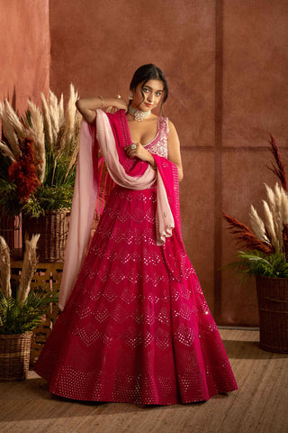 Hot pink mirror embroidered lehenga with raw silk blouse paIred with chikankari Ombre dupatta