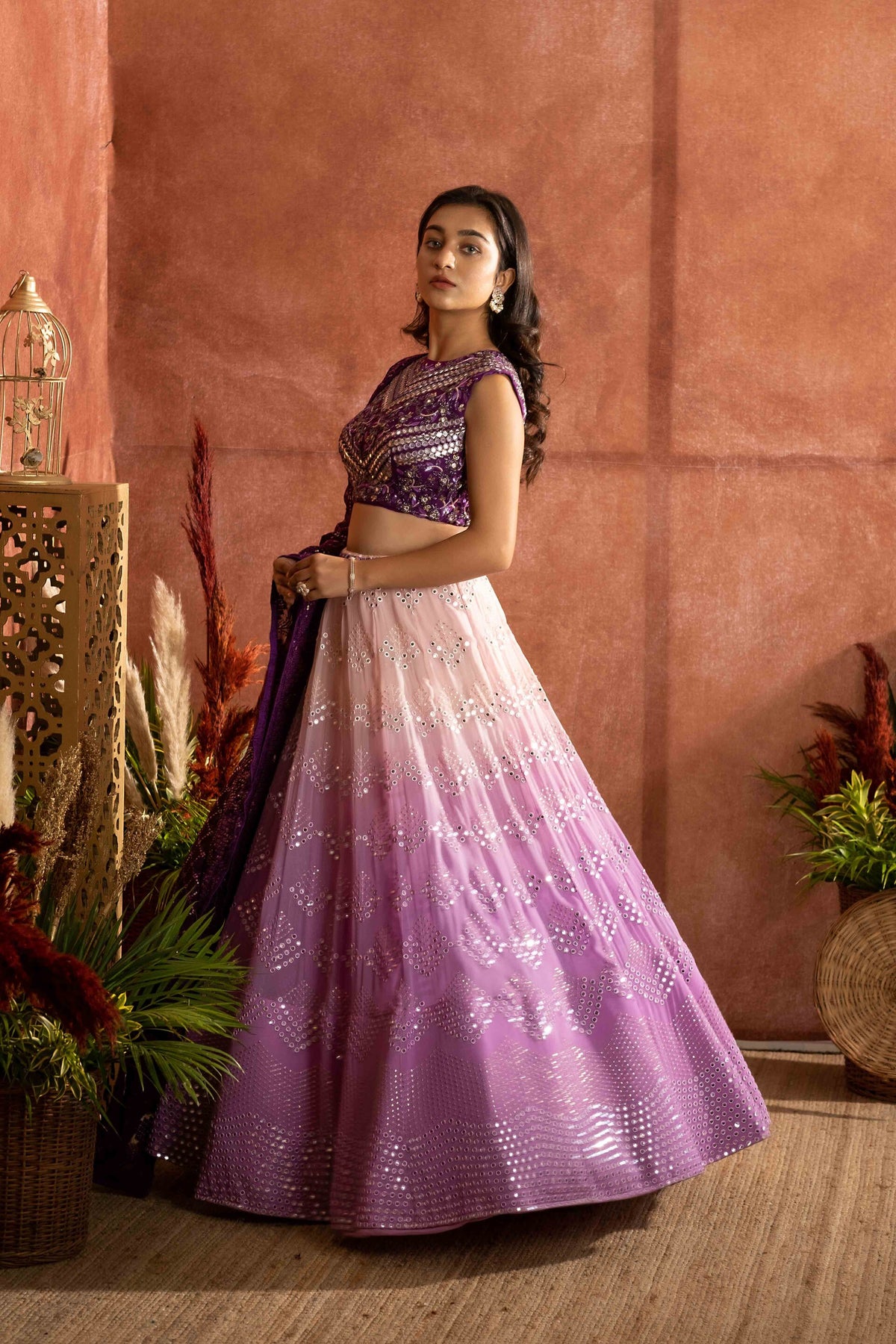 Peach to lavender Ombre lehenga with purple embroider blouse paired with chikankari dupatta