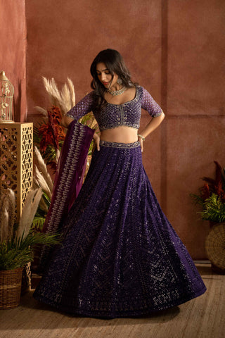 Purple chikankari lehenga with raw silk embroidered blouse paired with an organza embraided dupatta