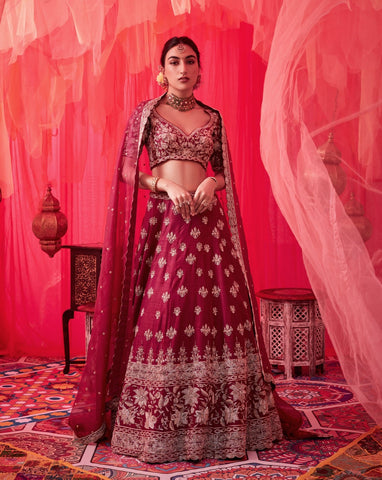 Wine raw silk embroidered lehenga with embroiderd blouse paired with organza dupatta