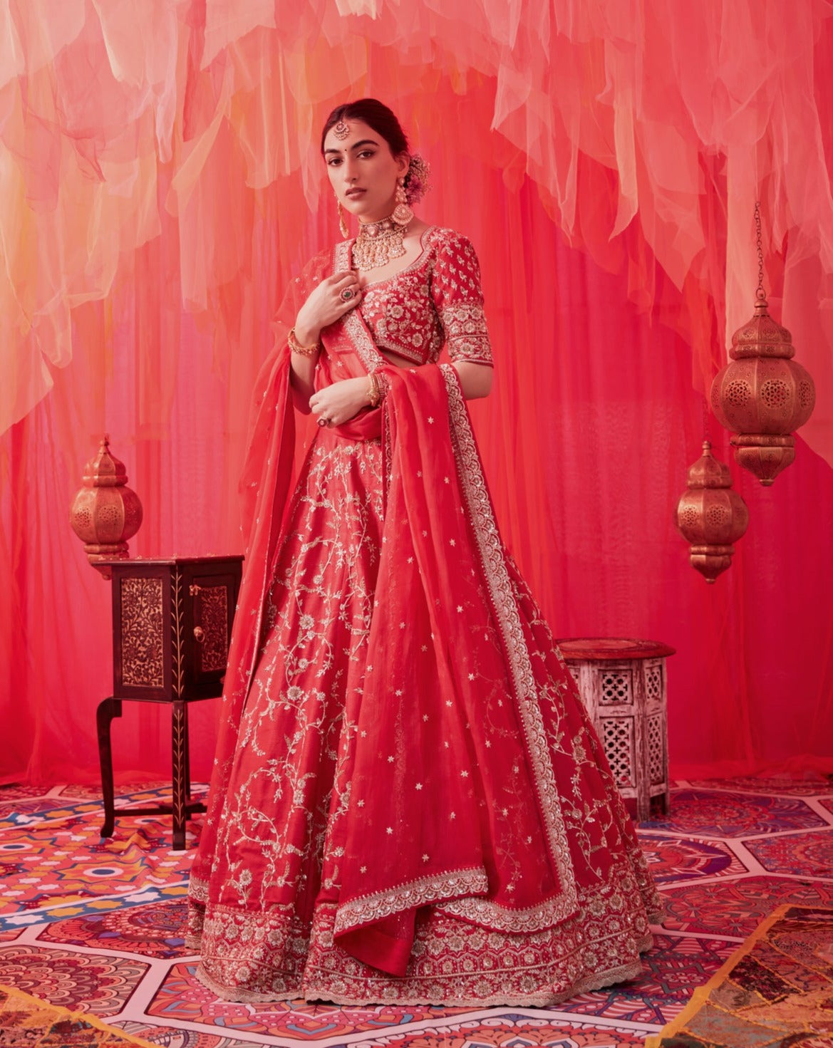 Red Raw silk Embroidered lehenga with embroidered blouse paired with an organza dupatta