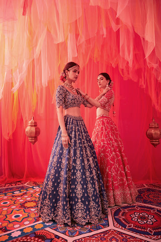 Peacock blue raw silk embroidered lehenga with blouse paired with an organza dupatta