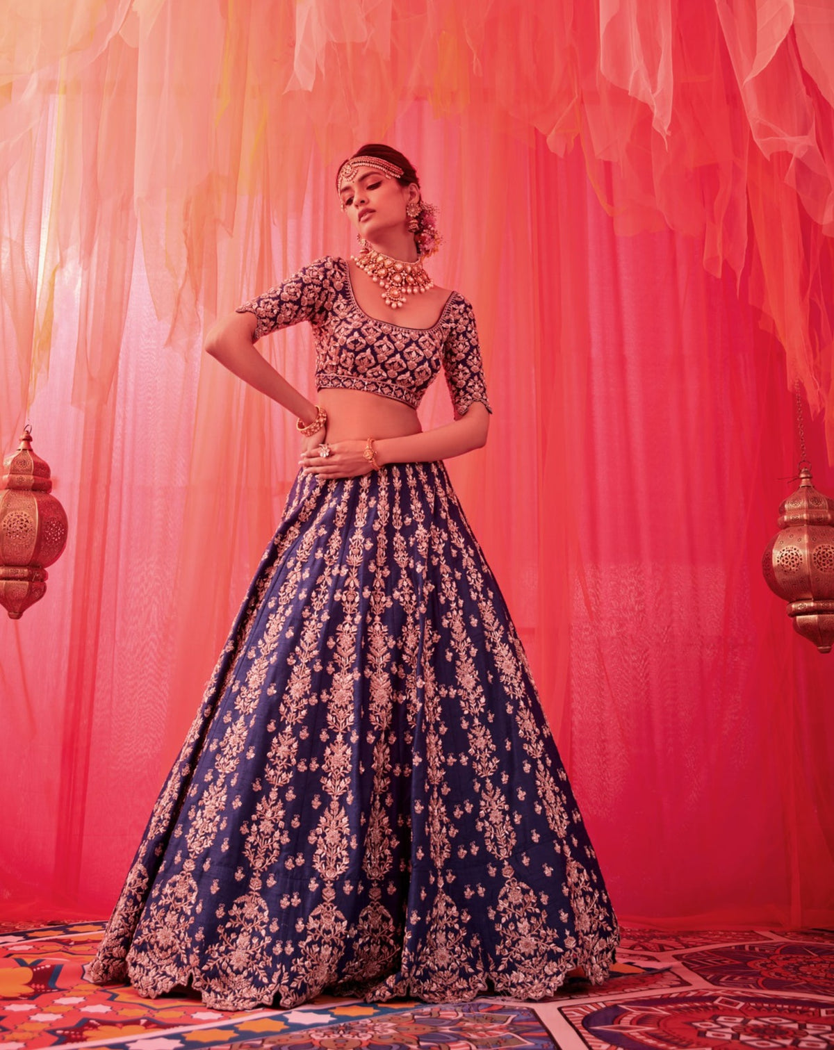 Peacock blue raw silk embroidered lehenga with blouse paired with an organza dupatta
