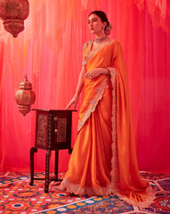 TANGERINE ORANGE EMBROIDERED CUTWORK SAREE WITH RAW SILK EMBROIDERED BLOUSE